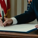 presidents hand signing official documents
