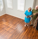 real estate agent showing to senior couple a new home
