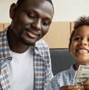 Father and son depositing cash