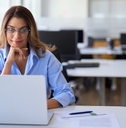 employee worker looking at laptop at workplace