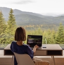 woman working remotely with picturesque view