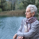 senior woman on the side of river
