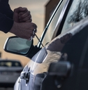 auto thief in black balaclava