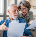 senior couple reading documents