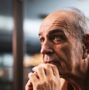 Close up portrait of pensive and worried senior man