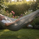 Man relaxes in hammock