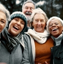 group of smiling retirees outdoors