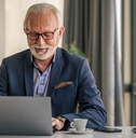 senior businessman working on laptop