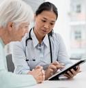 senior woman with doctor for consultation