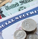 social security number card and calculator on American flag
