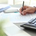 Tax accountant working with documents at table