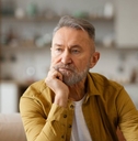 Portrait of thoughtful senior man looking away