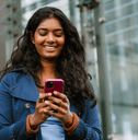 Woman looking at phone in city