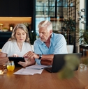 couple reviewing financial documents