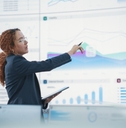 female data scientist reviewing reports