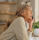 woman thinking at home for retirement