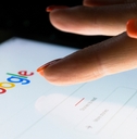 A woman&#x27;s hand is touching screen on tablet
