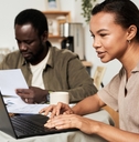 Couple using computer to do taxes