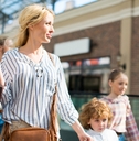 Blond woman shopping with kids at the mall