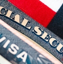 Social Security card on patriotic background
