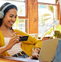 Girl on laptop with debit card