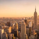 View of New York City skyline from high up at sunset