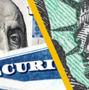 Close up of Social Security cards and checks