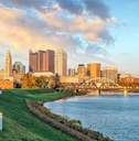 Ohio landscape showing Columbus skyline and buildings with lake in the foreground