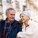 older couple walking outdoors during winter