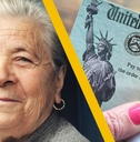 older woman smiling with social security check