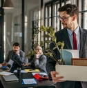 Man walking away fired from office job