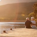 retireed couple sitting on dock
