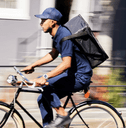 person working delivery gig on bike