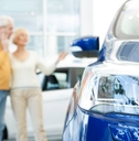 Senior couple choosing a new car to buy
