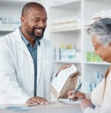pharmacist and woman at counter 