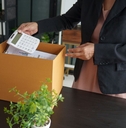 female packing up desk