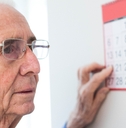 Senior looking at calendar