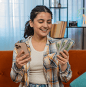 Girl with cell phone and cash