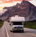 White RV Driving on scenic road