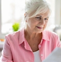 older woman reviewing papers