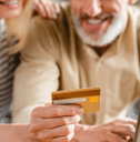 Older couple using a credit card online