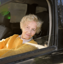 Grandma driving kid in car