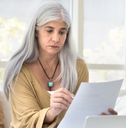 older woman reviewing papers