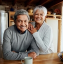 smiling older couple in kitchen