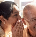 Elderly people sharing a secret
