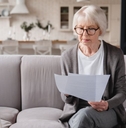 senior woman reviewing paperwork