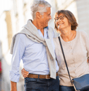 Older couple walking on street