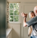 Senior couple dancing at home 