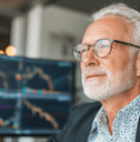 Older man looking at stock market