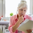 senior woman reviewing papers
